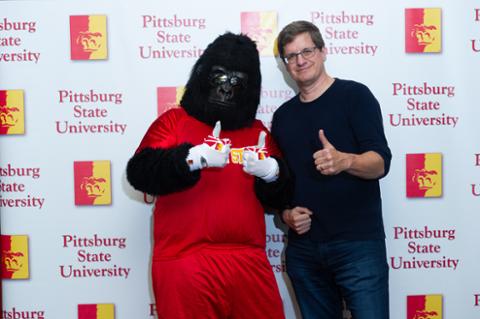 Gus the Gorilla and Brian McClendon posing for the camera.