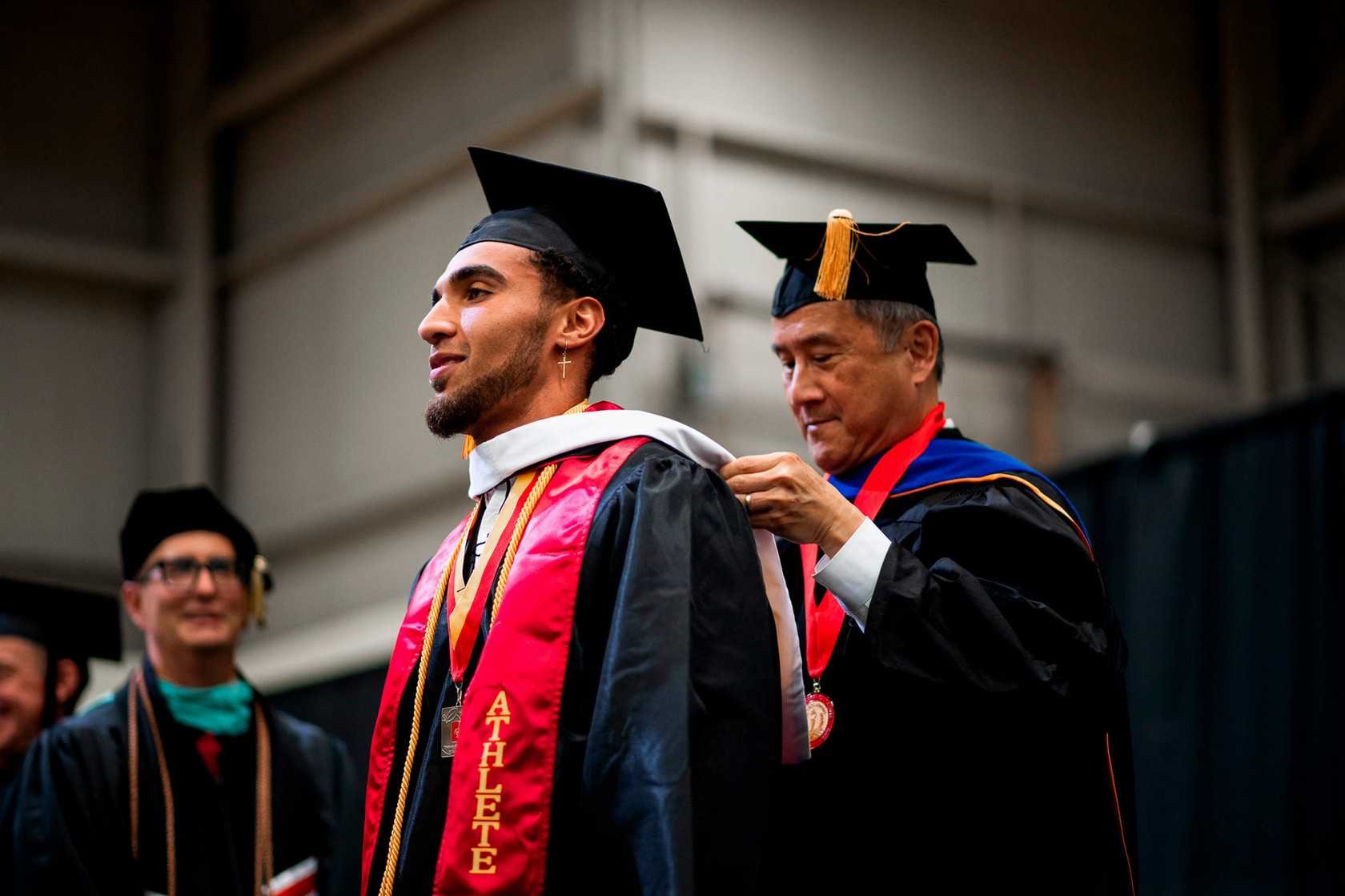 Graduate in cap and gown at commencement ceremony