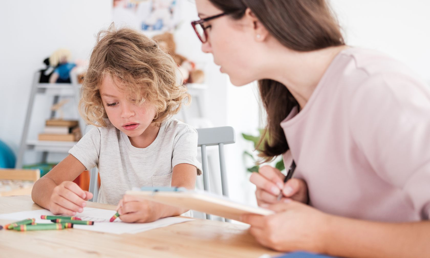 child being evaluated by adult