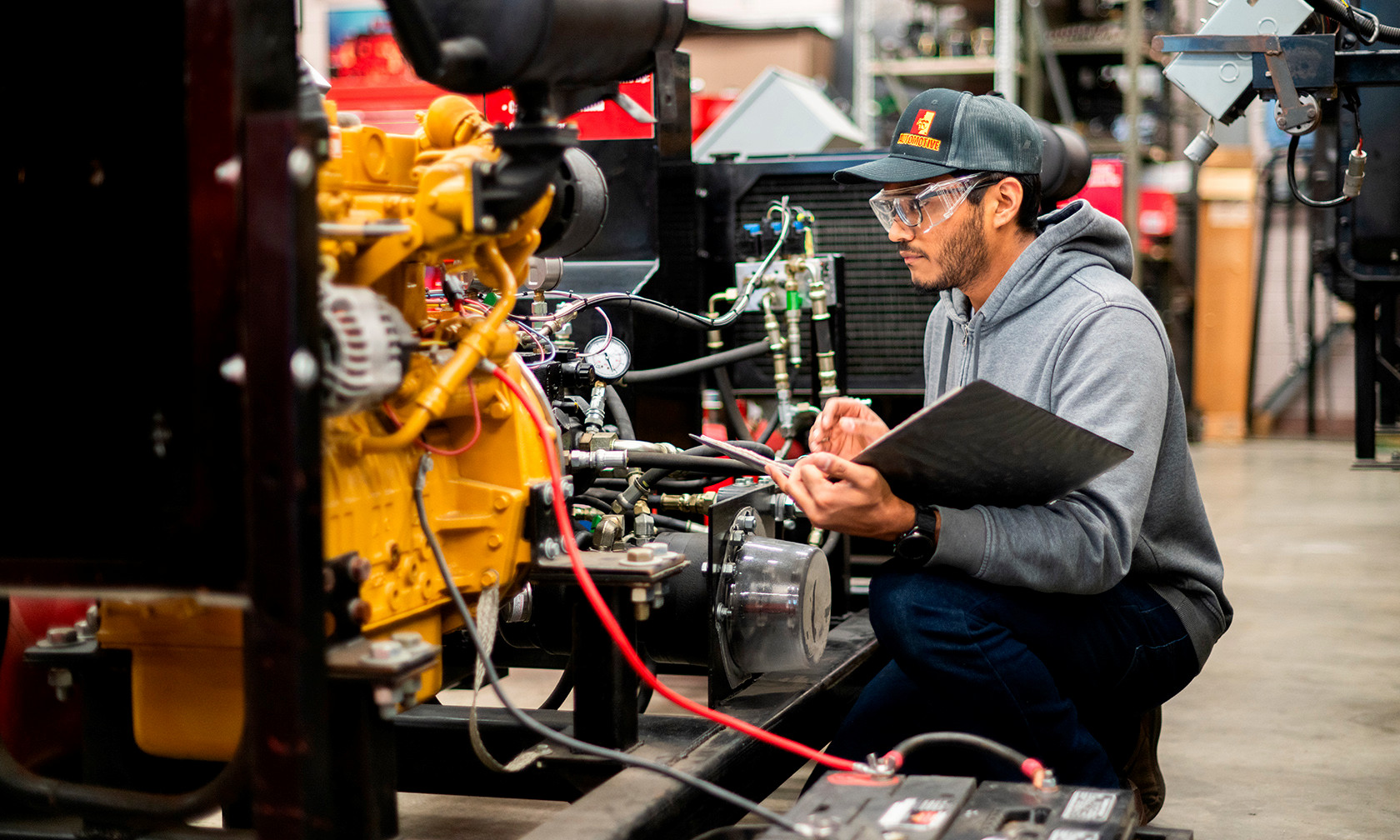 student in heavy diesel lab with machines