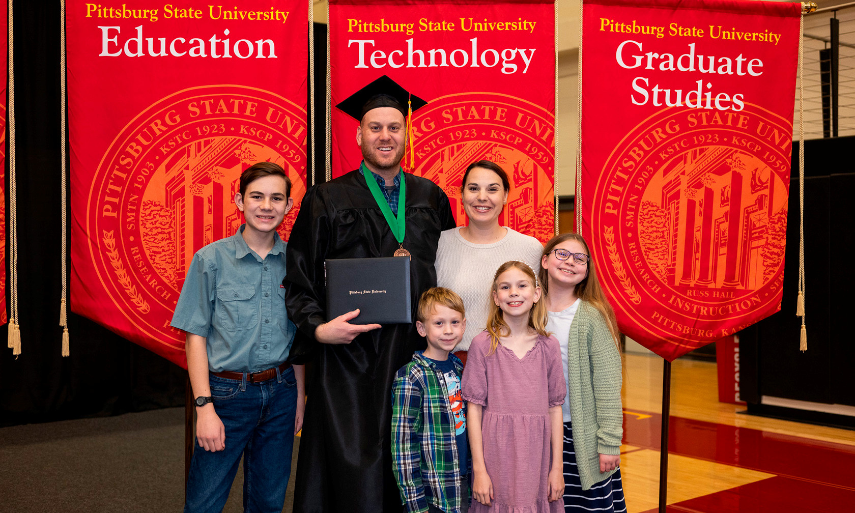 Graduate in cap and gown at commencement ceremony