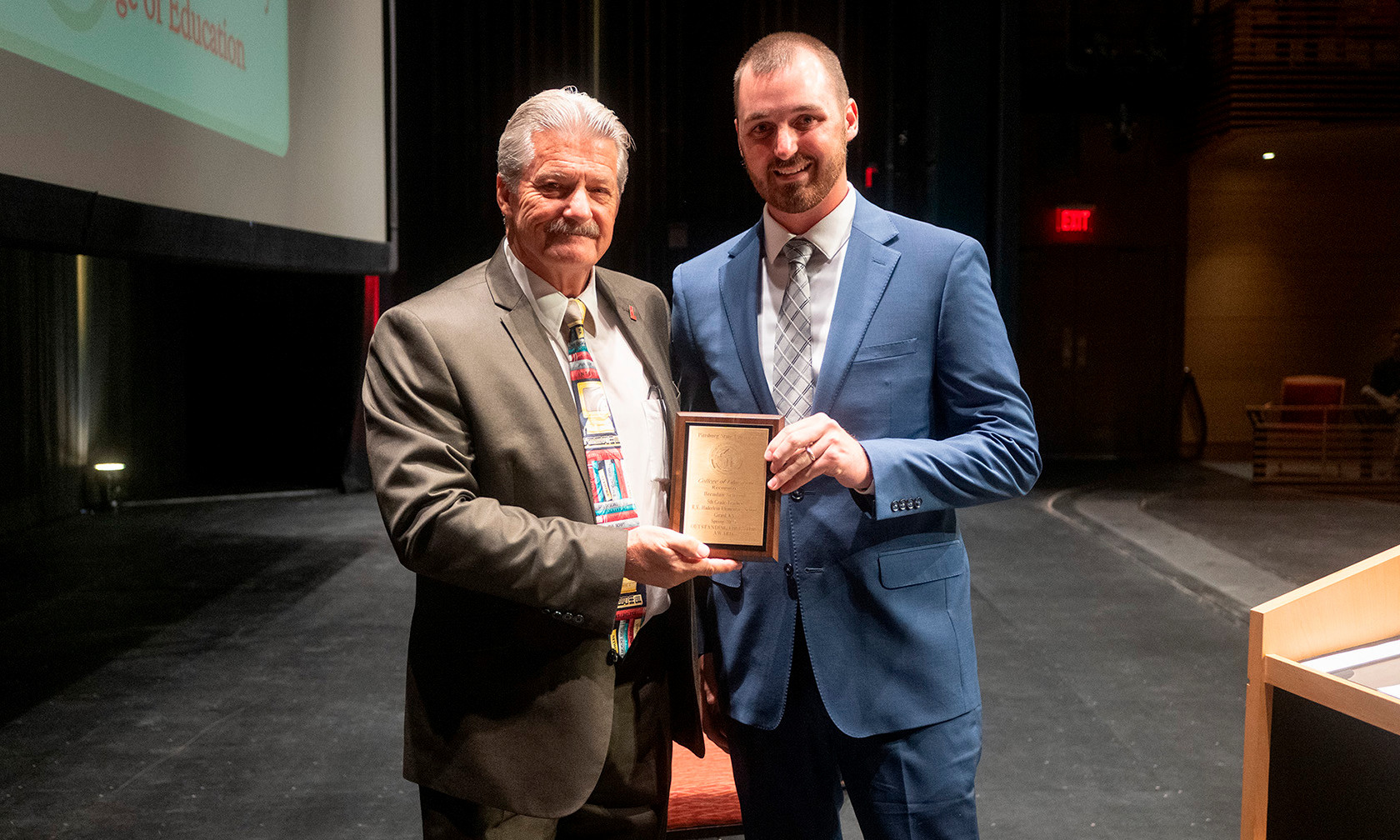 Award recipient with plaque