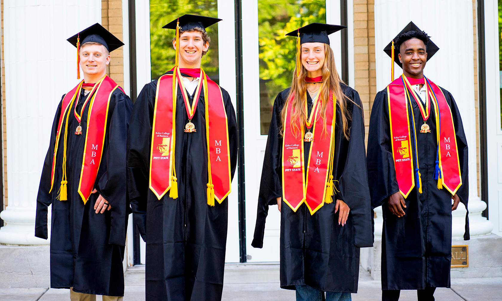 students in grad caps and gowns