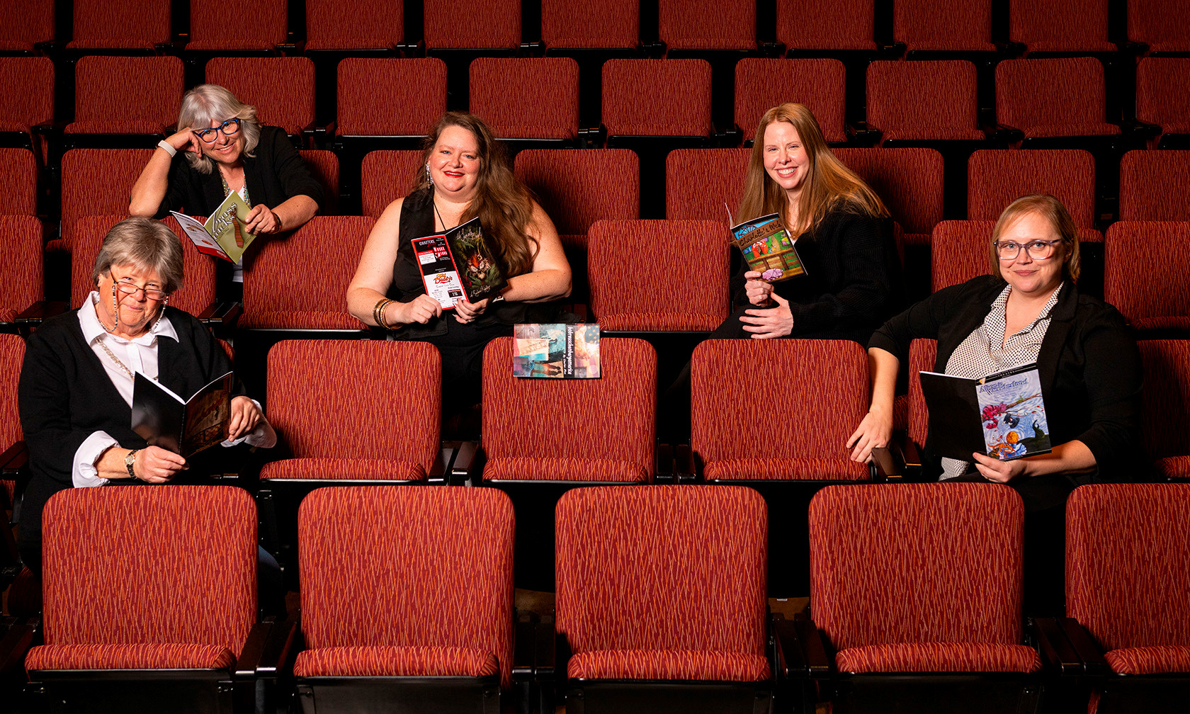 Five women in theater seats