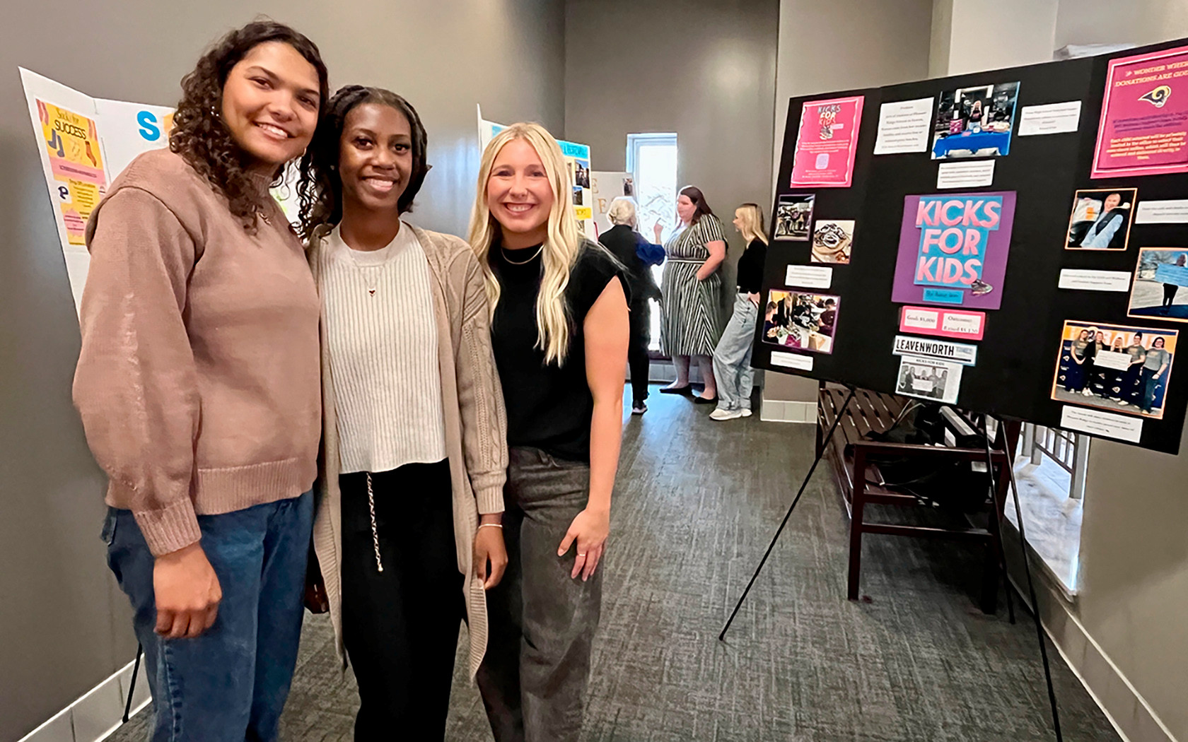 social work students posing Infront of projects