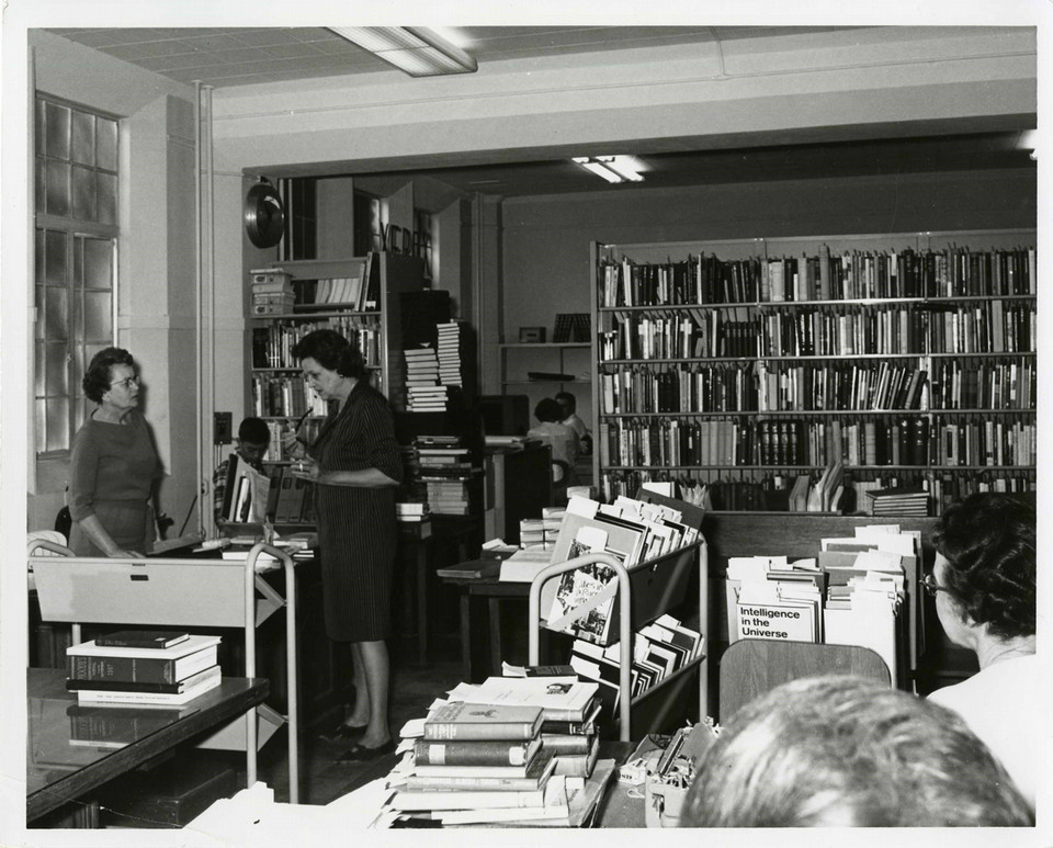 Antique photo of librarians working in the old Porter Library